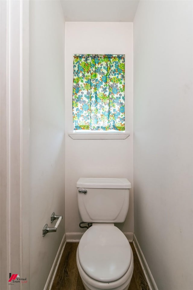 5023 Dedman Dr, Shreveport, LA 71107 - bathroom with wood finished floors, baseboards, and toilet