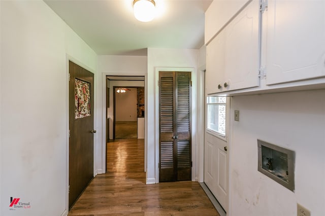 5023 Dedman Dr, Shreveport, LA 71107 - laundry area featuring cabinet space, washer hookup, wood finished floors, and baseboards
