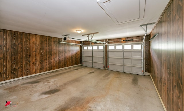 5023 Dedman Dr, Shreveport, LA 71107 - garage featuring wood walls and a garage door opener