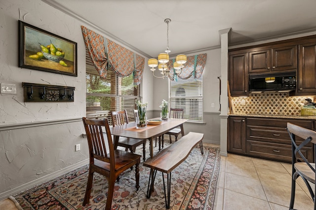 4213 Fairway Crossing Dr, Fort Worth, TX 76137 - dining room featuring a chandelier, crown molding, baseboards, and light tile patterned floors