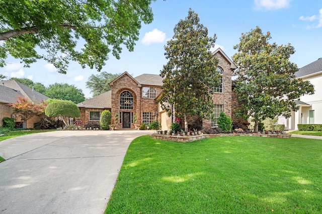 4213 Fairway Crossing Dr, Fort Worth, TX 76137 - traditional home with driveway, a front lawn, brick siding, and a garage