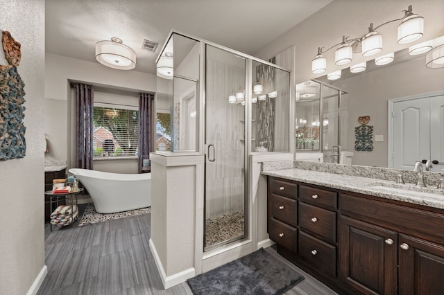 4213 Fairway Crossing Dr, Fort Worth, TX 76137 - bathroom featuring vanity, a stall shower, and a freestanding tub