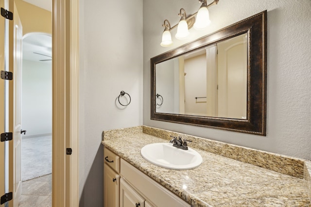 301 Harrison Cir, Van Alstyne, TX 75495 - bathroom with vanity and a textured wall