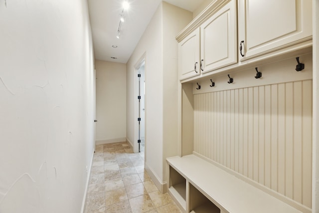 301 Harrison Cir, Van Alstyne, TX 75495 - mudroom with baseboards and light stone finish floors