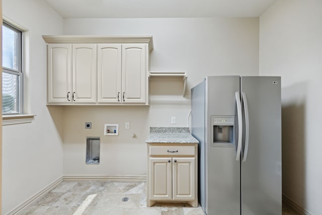301 Harrison Cir, Van Alstyne, TX 75495 - clothes washing area with hookup for an electric dryer, cabinet space, baseboards, hookup for a washing machine, and gas dryer hookup