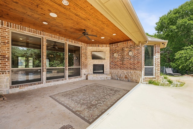 301 Harrison Cir, Van Alstyne, TX 75495 - view of patio / terrace with an outdoor stone fireplace and a ceiling fan