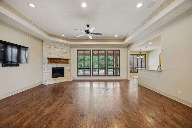 301 Harrison Cir, Van Alstyne, TX 75495 - unfurnished living room featuring crown molding, wood-type flooring, a ceiling fan, a chandelier, and a fireplace