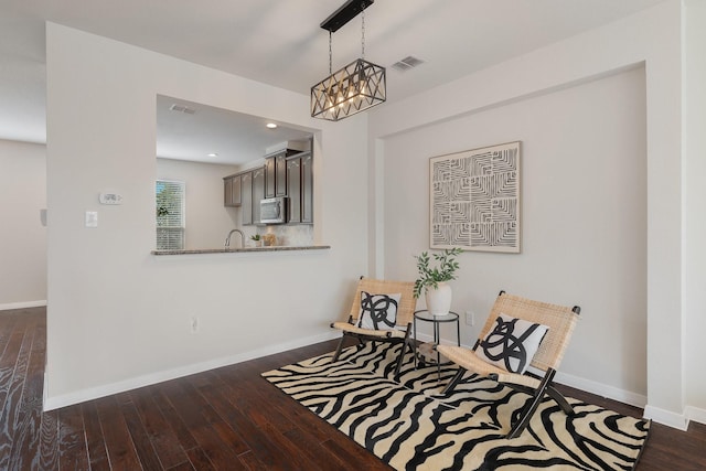 3924 Asbury Ln, Addison, TX 75001 - dining area featuring dark wood-style floors, a chandelier, and baseboards