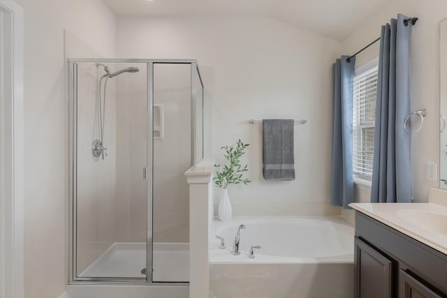 3924 Asbury Ln, Addison, TX 75001 - full bath featuring a stall shower, a bath, vanity, and lofted ceiling