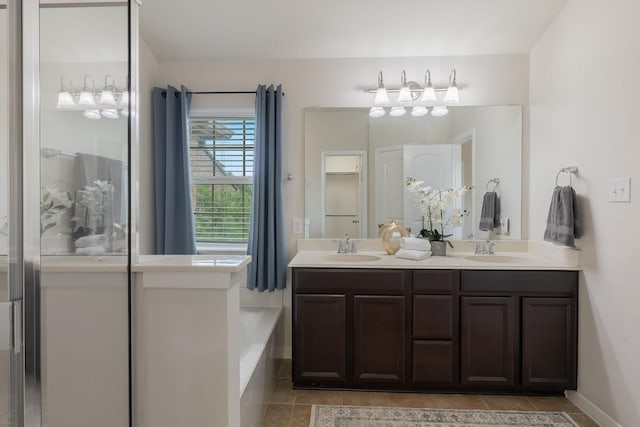 3924 Asbury Ln, Addison, TX 75001 - bathroom featuring tile patterned floors, double vanity, a shower, and a tub
