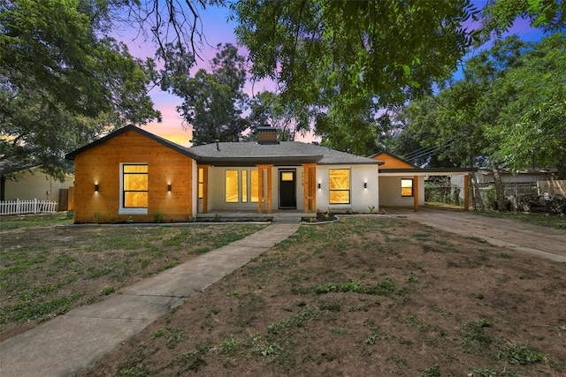 3112 Aster Ave, Fort Worth, TX 76111 - view of front of home featuring driveway, a chimney, and a carport