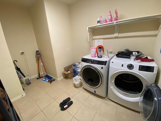 5833 N Silverton Ave, Mckinney, TX 75070 - laundry room featuring separate washer and dryer, light tile patterned flooring, and baseboards