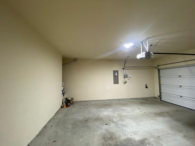 5833 N Silverton Ave, Mckinney, TX 75070 - garage featuring a garage door opener and electric panel