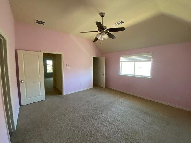 5833 N Silverton Ave, Mckinney, TX 75070 - unfurnished bedroom with vaulted ceiling, multiple windows, carpet floors, baseboards, and ceiling fan