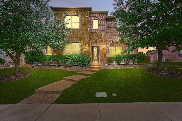 1004 Taylor Dr, Allen, TX 75013 - view of front of house featuring stone siding and a yard