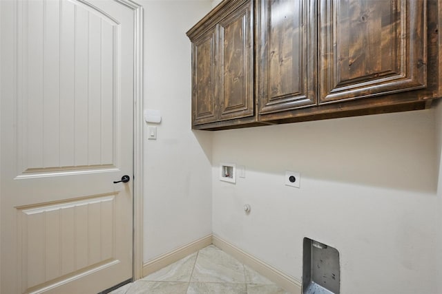 1004 Taylor Dr, Allen, TX 75013 - laundry area with cabinet space, hookup for an electric dryer, baseboards, light marble finish floors, and hookup for a washing machine