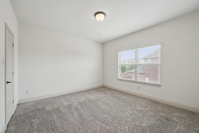 1004 Taylor Dr, Allen, TX 75013 - spare room featuring carpet flooring and baseboards