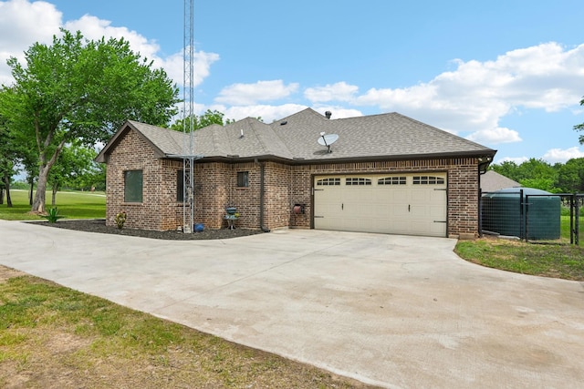1389 County Road 3591, Paradise, TX 76073 - view of front of home featuring driveway, a garage, brick siding, and a shingled roof