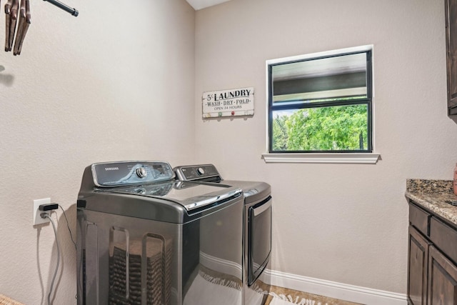 1389 County Road 3591, Paradise, TX 76073 - laundry room with washer and dryer, cabinet space, and baseboards