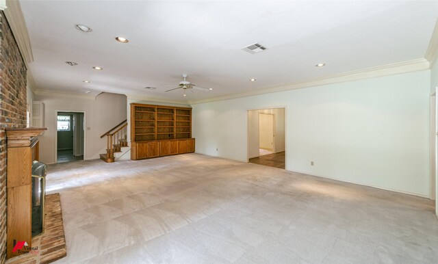 9855 Holamy Ln, Shreveport, LA 71106 - unfurnished living room featuring ornamental molding, light colored carpet, a ceiling fan, stairs, and recessed lighting