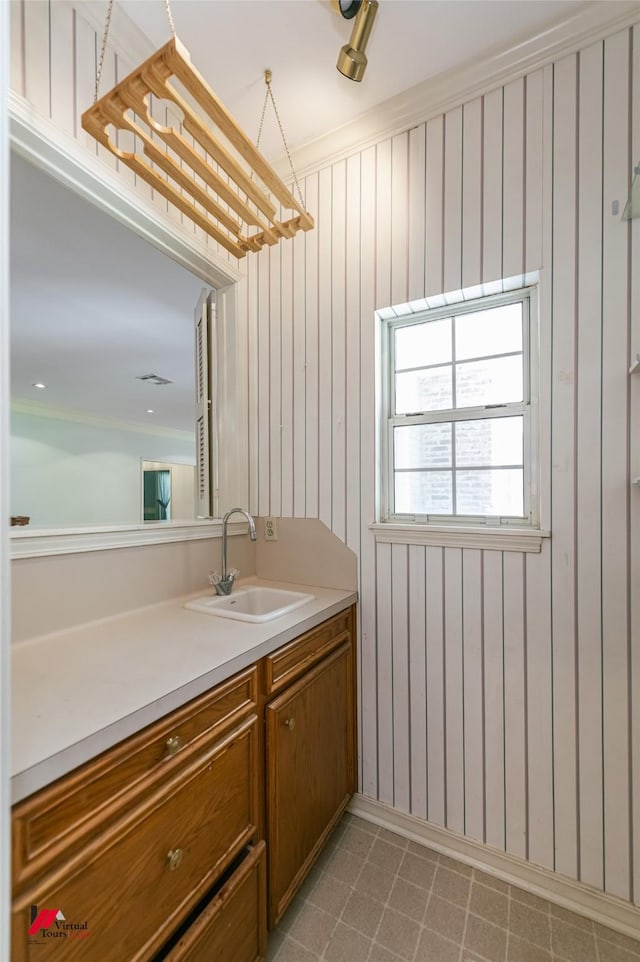 9855 Holamy Ln, Shreveport, LA 71106 - bathroom featuring vanity and wood walls