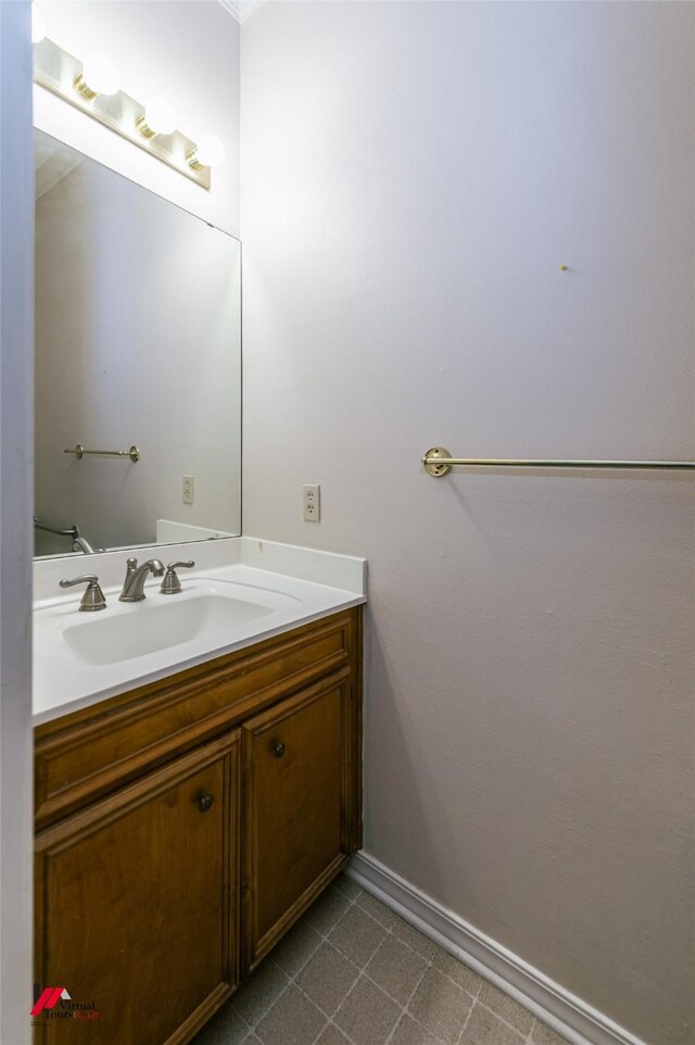 9855 Holamy Ln, Shreveport, LA 71106 - bathroom with baseboards, vanity, and tile patterned flooring