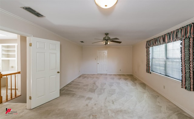 9855 Holamy Ln, Shreveport, LA 71106 - unfurnished room with ceiling fan, light carpet, crown molding, and baseboards