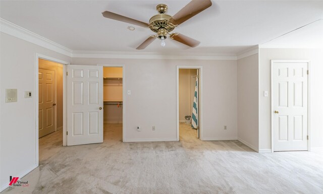 9855 Holamy Ln, Shreveport, LA 71106 - unfurnished bedroom with carpet, ornamental molding, a spacious closet, and baseboards