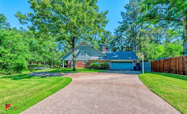 9855 Holamy Ln, Shreveport, LA 71106 - traditional home with asphalt driveway, brick siding, an attached garage, and a chimney