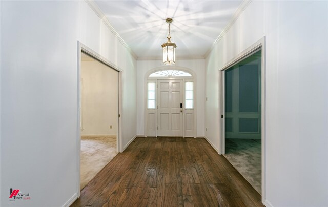 9855 Holamy Ln, Shreveport, LA 71106 - foyer entrance with dark wood-style flooring, ornamental molding, and baseboards
