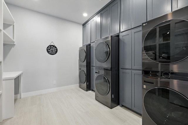 4971 Hawk Rd, Possum Kingdom Lake, TX 76450 - laundry area featuring stacked washer / drying machine, cabinet space, baseboards, recessed lighting, and light wood finished floors