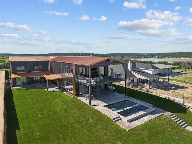4971 Hawk Rd, Possum Kingdom Lake, TX 76450 - back of property featuring a patio area, metal roof, and an outdoor pool