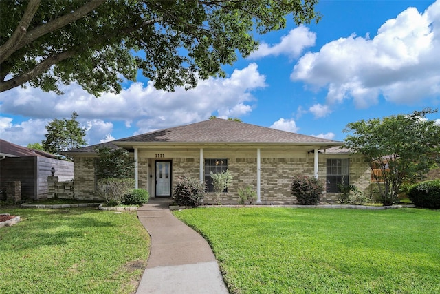 1111 Lupine Dr, Garland, TX 75043 - ranch-style house with a front yard and brick siding