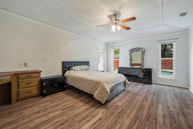 1111 Lupine Dr, Garland, TX 75043 - bedroom with wood finished floors, a textured ceiling, and ceiling fan