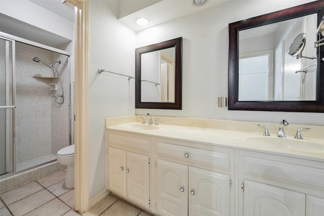 1111 Lupine Dr, Garland, TX 75043 - full bath featuring a stall shower, toilet, double vanity, and tile patterned floors