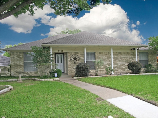 1111 Lupine Dr, Garland, TX 75043 - ranch-style house with brick siding, a front yard, and roof with shingles