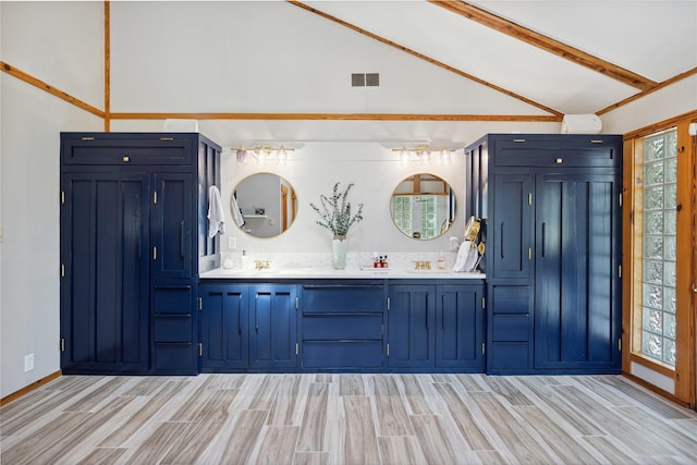 831 Old Justin Rd, Argyle, TX 76226 - bathroom with wood finish floors, double vanity, beamed ceiling, and high vaulted ceiling