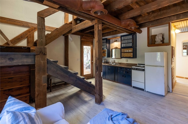 831 Old Justin Rd, Argyle, TX 76226 - kitchen featuring white appliances, open shelves, light wood finished floors, and a wooden ceiling with exposed beams