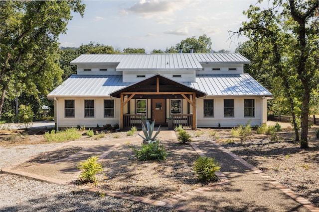831 Old Justin Rd, Argyle, TX 76226 - modern inspired farmhouse with a porch and a metal roof
