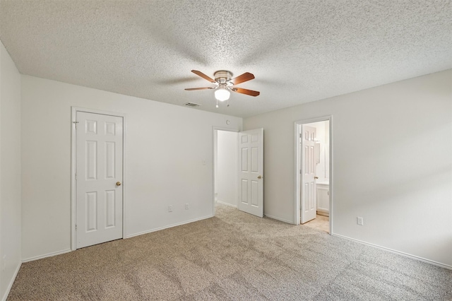 4111 Cypress Springs Dr, Arlington, TX 76001 - unfurnished bedroom with carpet floors, baseboards, a ceiling fan, ensuite bathroom, and a textured ceiling