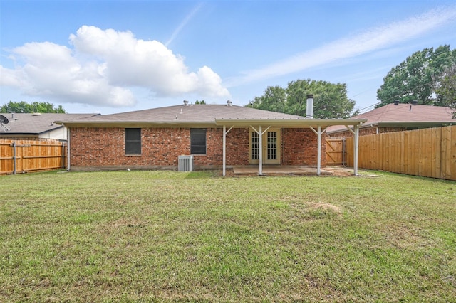 4111 Cypress Springs Dr, Arlington, TX 76001 - rear view of property with central AC unit, a patio area, and brick siding