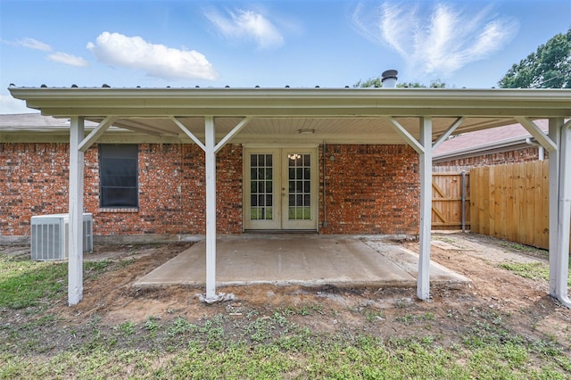 4111 Cypress Springs Dr, Arlington, TX 76001 - view of patio / terrace with french doors, central AC, and fence