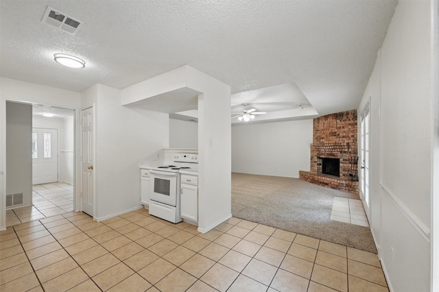 4111 Cypress Springs Dr, Arlington, TX 76001 - kitchen featuring white electric range, light tile patterned flooring, a textured ceiling, light carpet, and ceiling fan