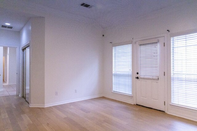 2104 Hunter Place Ln, Arlington, TX 76006 - spare room with light wood finished floors, baseboards, and plenty of natural light