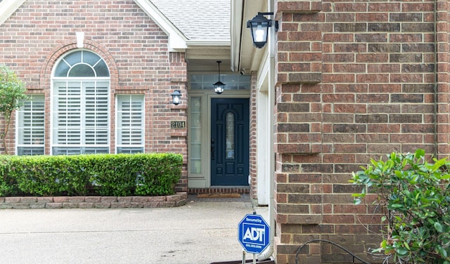 2104 Hunter Place Ln, Arlington, TX 76006 - property entrance featuring brick siding and a shingled roof