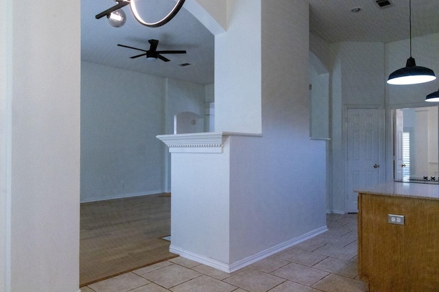 2104 Hunter Place Ln, Arlington, TX 76006 - kitchen featuring light tile patterned floors, ceiling fan, decorative light fixtures, and baseboards