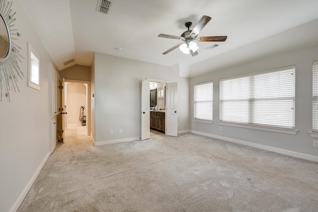 320 Collins St, Argyle, TX 76226 - unfurnished bedroom featuring light carpet, vaulted ceiling, baseboards, ensuite bathroom, and ceiling fan