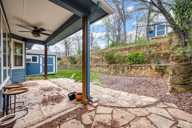 320 Collins St, Argyle, TX 76226 - view of patio / terrace with a ceiling fan, a storage unit, a fenced backyard, and an outdoor structure