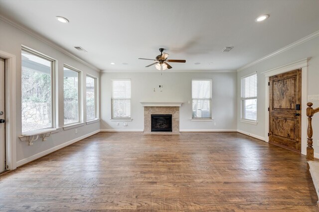 320 Collins St, Argyle, TX 76226 - unfurnished living room featuring ceiling fan, wood finished floors, ornamental molding, a fireplace with flush hearth, and baseboards