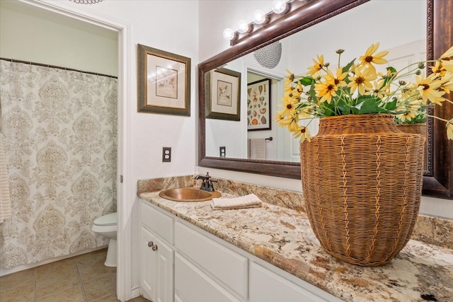10285 Peony Ln, Waco, TX 76708 - full bathroom featuring toilet, vanity, and tile patterned flooring
